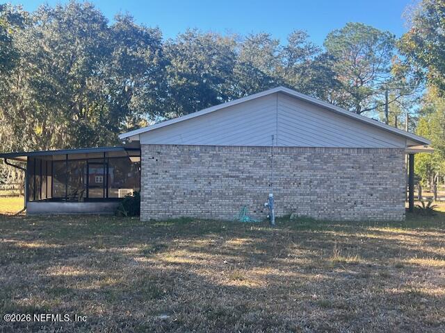 312 East Market Road Starke, FL 32091 - Photo 18 of 46 a backyard of a house with lots of green space