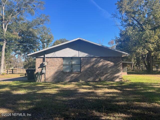 312 East Market Road Starke, FL 32091 - Photo 19 of 46 a view of a house with a yard