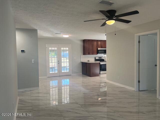 312 East Market Road Starke, FL 32091 - Photo 23 of 46 a view of a kitchen with microwave and a stove