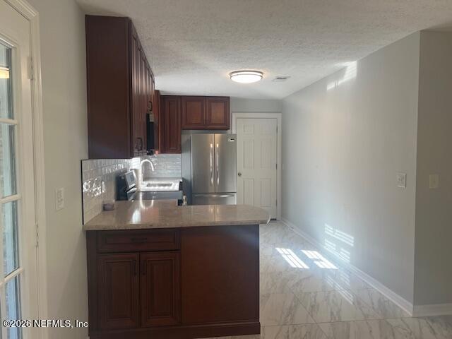 312 East Market Road Starke, FL 32091 - Photo 28 of 46 a kitchen with stainless steel appliances a sink and a refrigerator