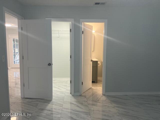 312 East Market Road Starke, FL 32091 - Photo 30 of 46 a view of an empty room with wooden floor and a window