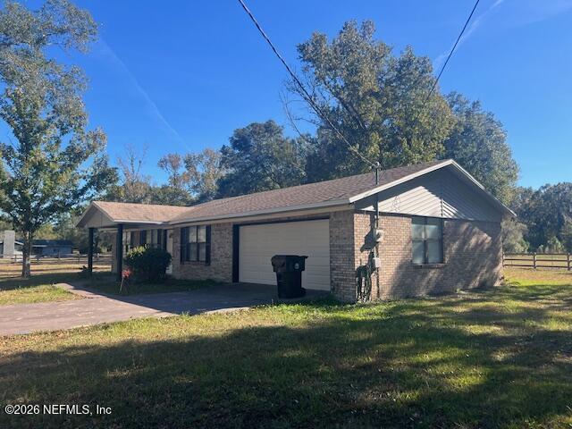 312 East Market Road Starke, FL 32091 - Photo 6 of 46 a view of a house with a yard