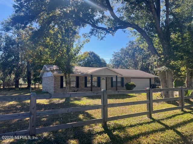 312 East Market Road Starke, FL 32091 - Photo 7 of 46 a front view of a house with swimming pool yard and outdoor seating