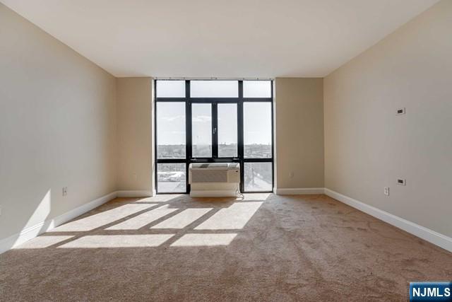 29 1st Street, Unit 401 Hackensack, NJ 07601 - Photo 13 of 26 a view of an empty room with a window