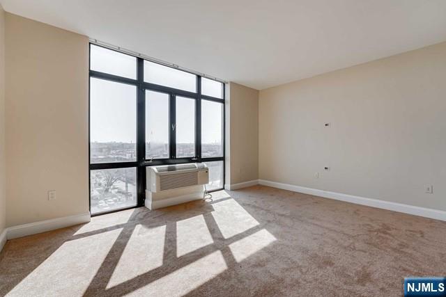 29 1st Street, Unit 401 Hackensack, NJ 07601 - Photo 15 of 26 a view of an empty room and window