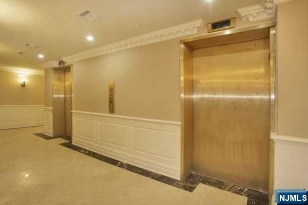 29 1st Street, Unit 401 Hackensack, NJ 07601 - Photo 23 of 26 a bathroom with a shower