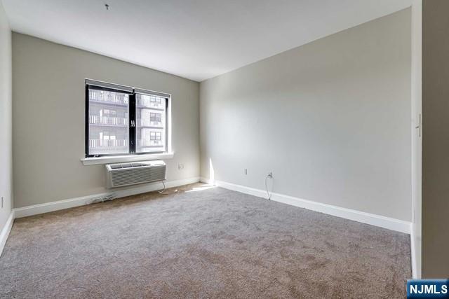 29 1st Street, Unit 401 Hackensack, NJ 07601 - Photo 8 of 26 an empty room with windows
