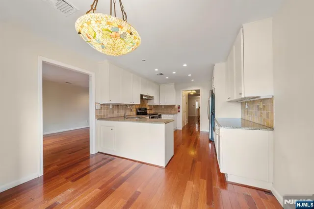 a view of kitchen with wooden floor and window