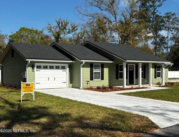 front view of a house with a yard