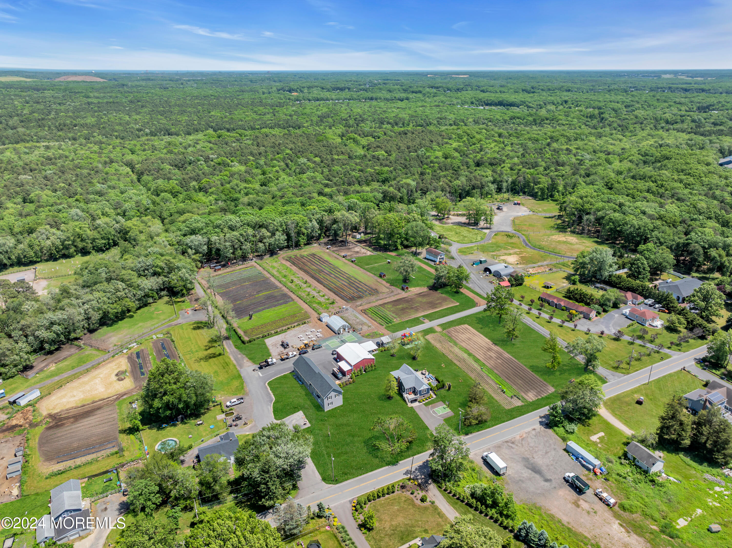 553 Colts Neck Road Farmingdale, NJ 07727 - Photo 11 of 52 an aerial view of residential houses with outdoor space and trees