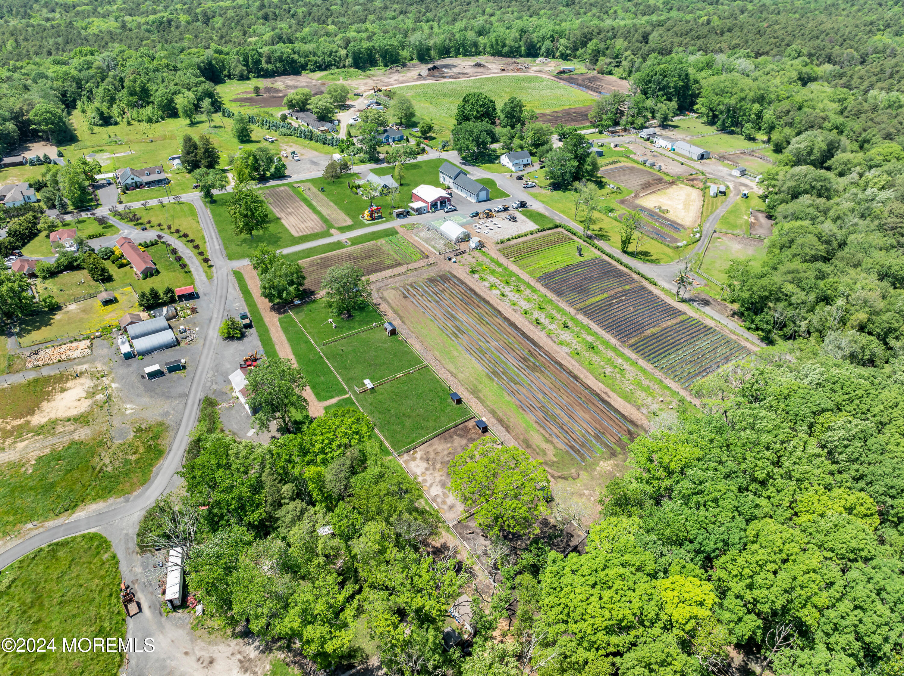 553 Colts Neck Road Farmingdale, NJ 07727 - Photo 14 of 52 an aerial view of residential houses with outdoor space