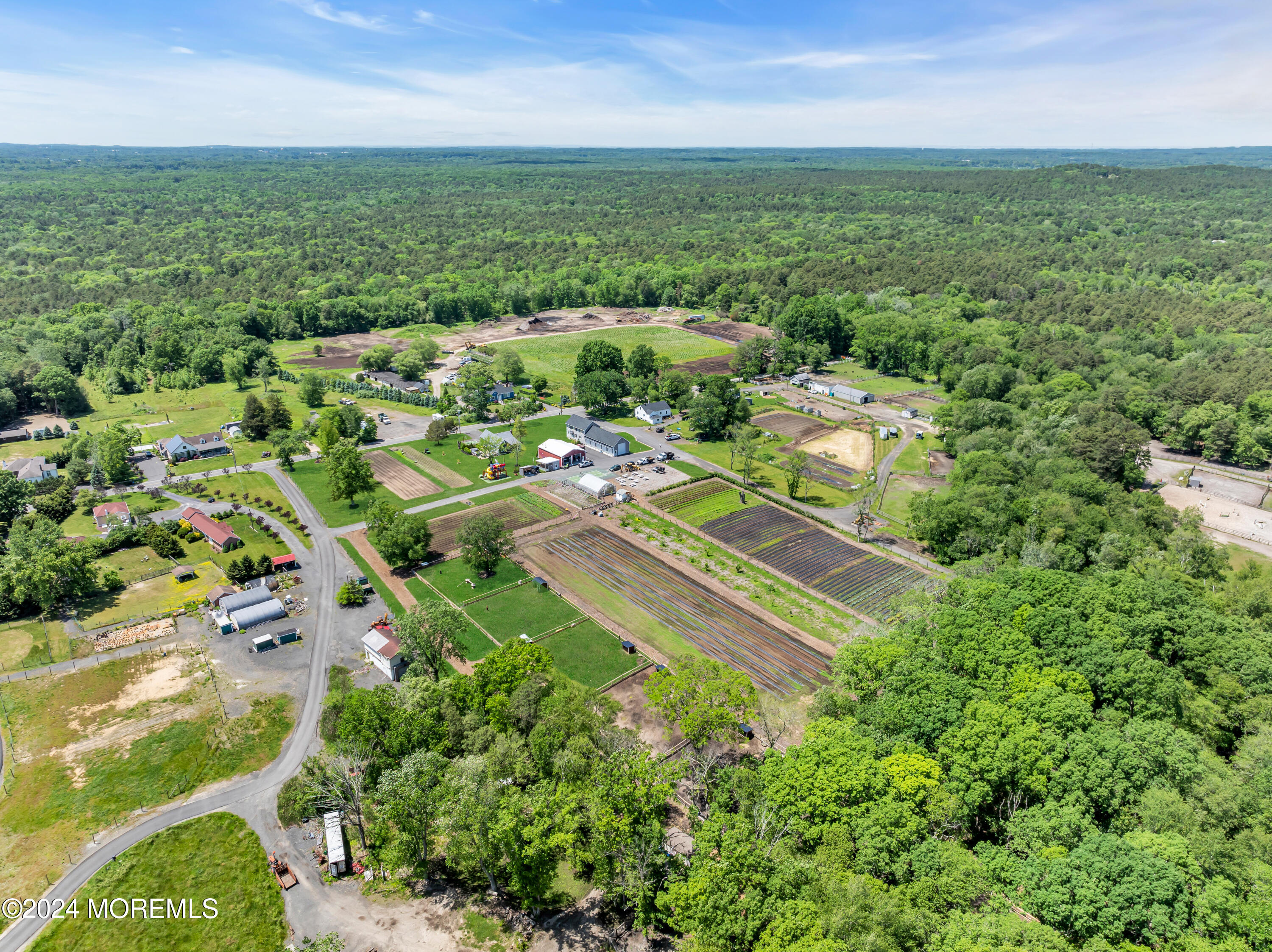 553 Colts Neck Road Farmingdale, NJ 07727 - Photo 15 of 52 an aerial view of residential houses with outdoor space and trees