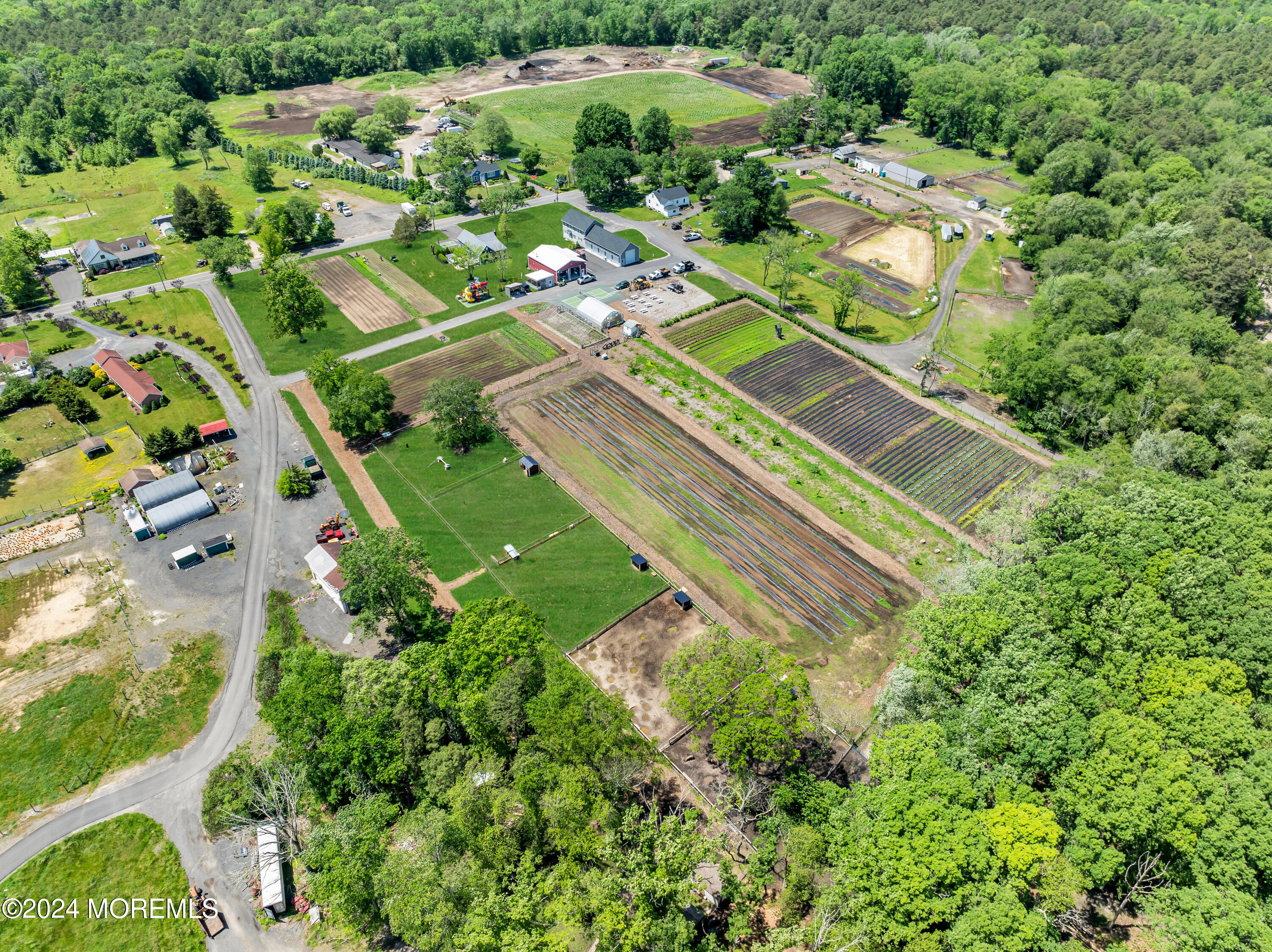 553 Colts Neck Road Farmingdale, NJ 07727 - Photo 16 of 52 an aerial view of a residential houses with a yard