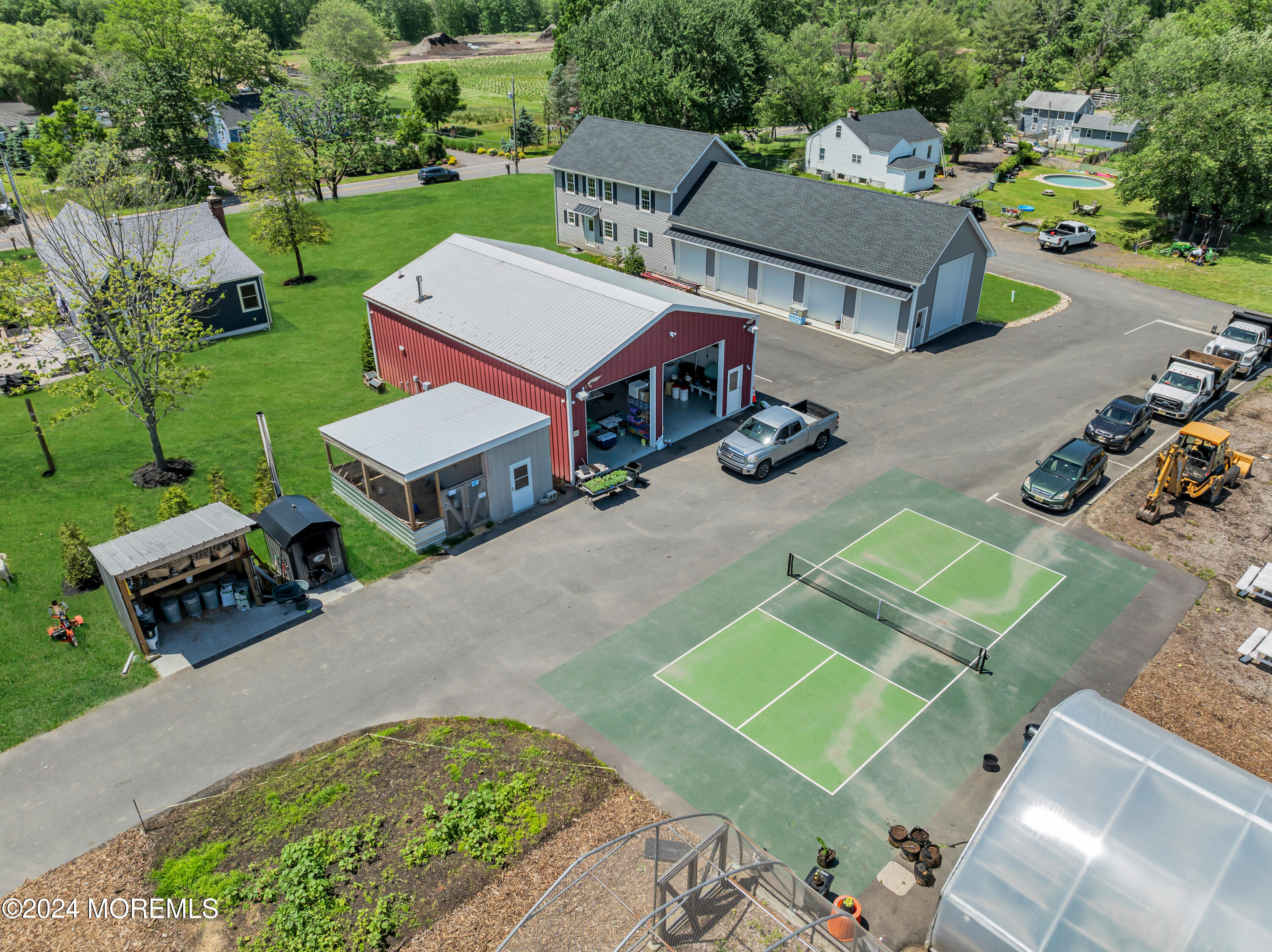 553 Colts Neck Road Farmingdale, NJ 07727 - Photo 19 of 52 an aerial view of a house with garden space and street view