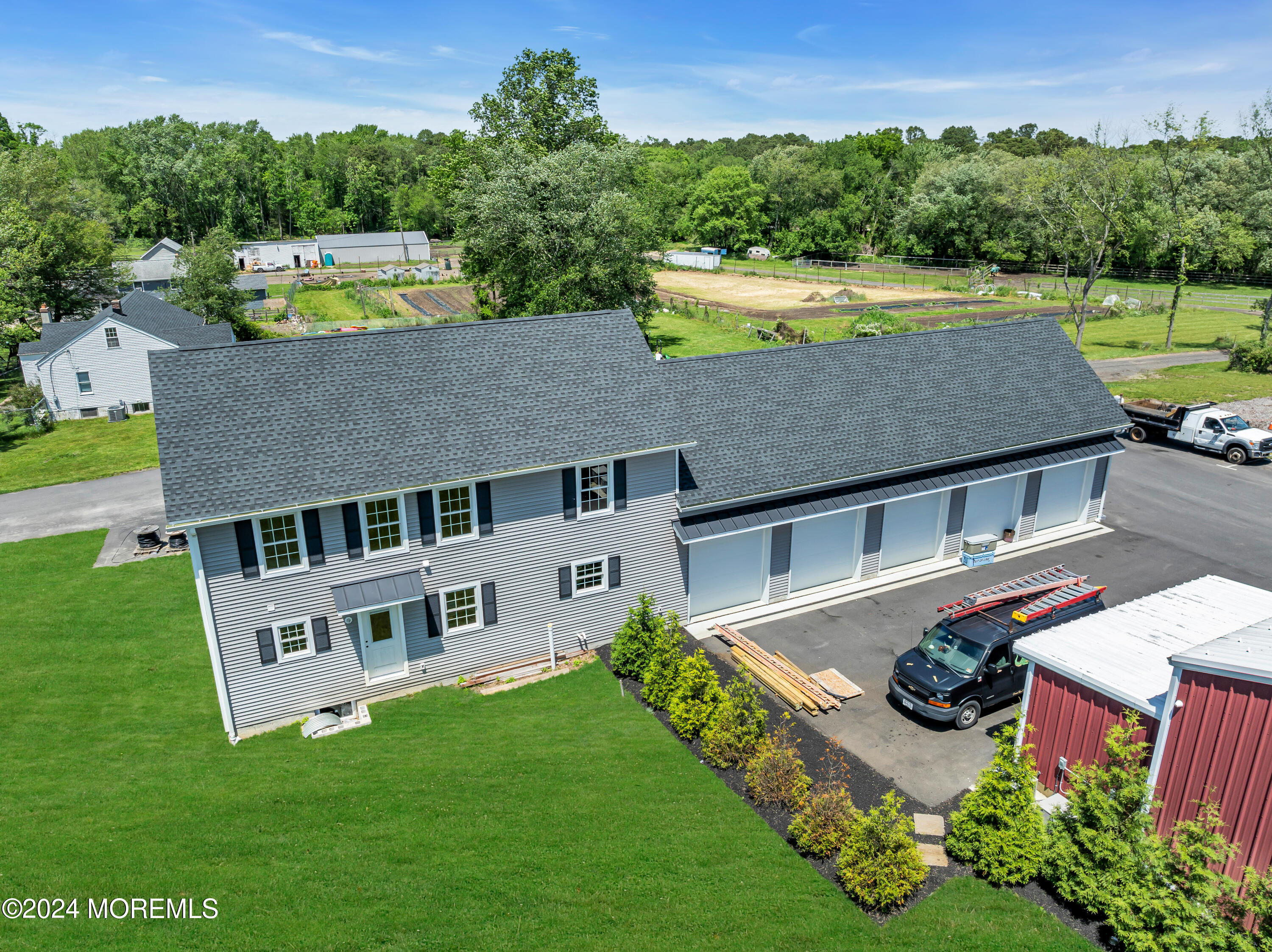 553 Colts Neck Road Farmingdale, NJ 07727 - Photo 20 of 52 an aerial view of a house with a garden and a yard