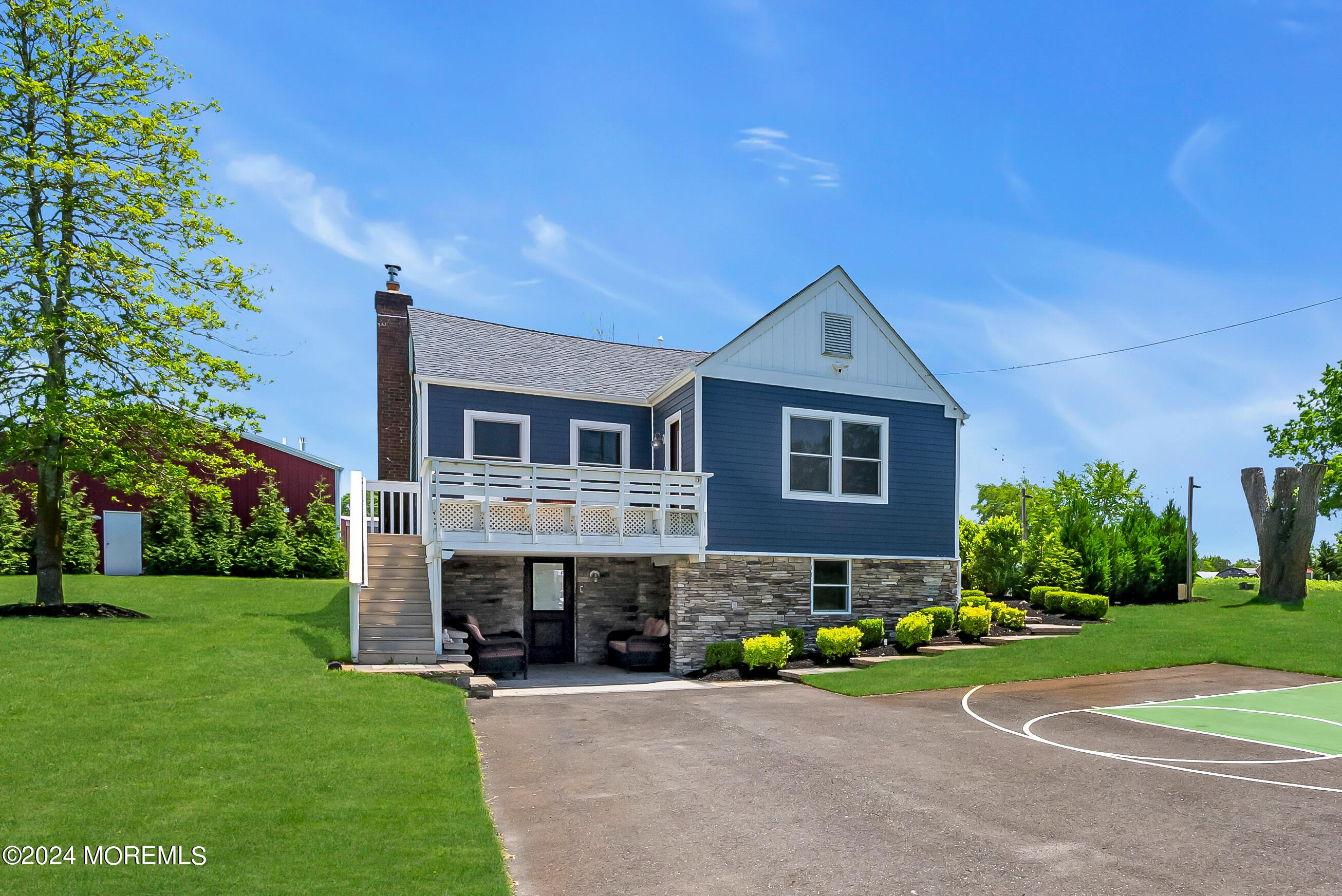 553 Colts Neck Road Farmingdale, NJ 07727 - Photo 30 of 52 a front view of a house with garden