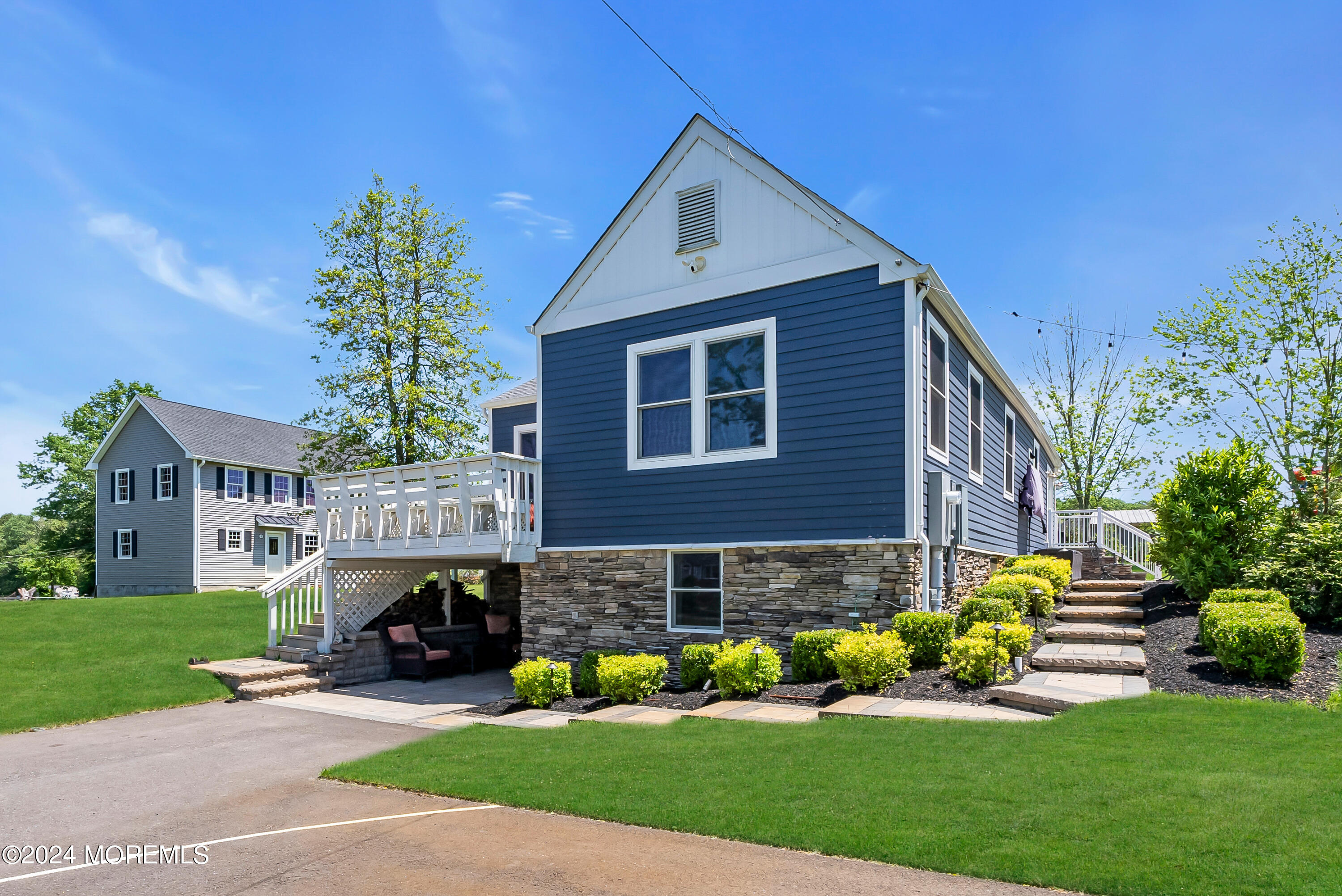 553 Colts Neck Road Farmingdale, NJ 07727 - Photo 34 of 52 a view of a house with a yard and sitting area
