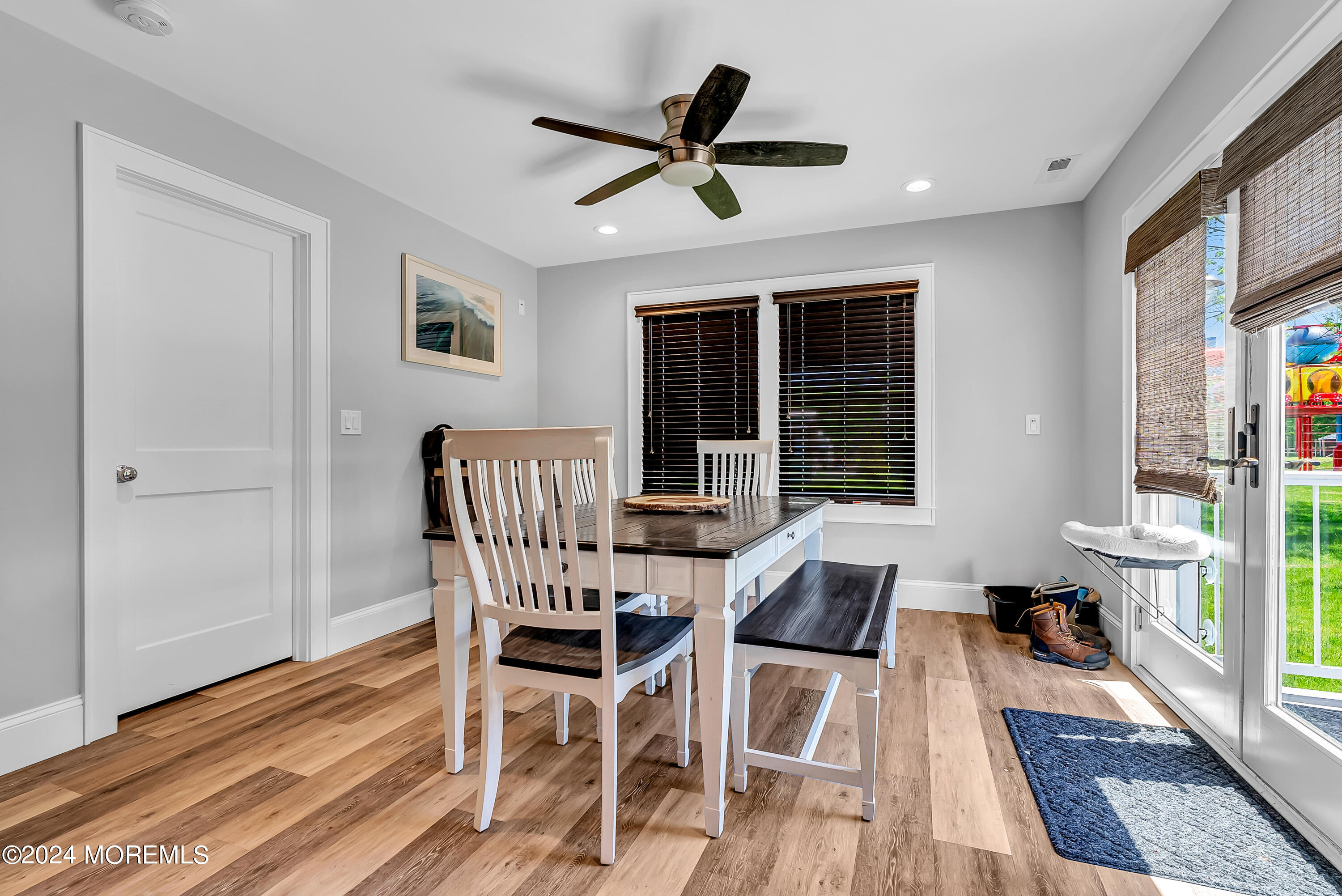 553 Colts Neck Road Farmingdale, NJ 07727 - Photo 36 of 52 a dining room with furniture a rug and wooden floor