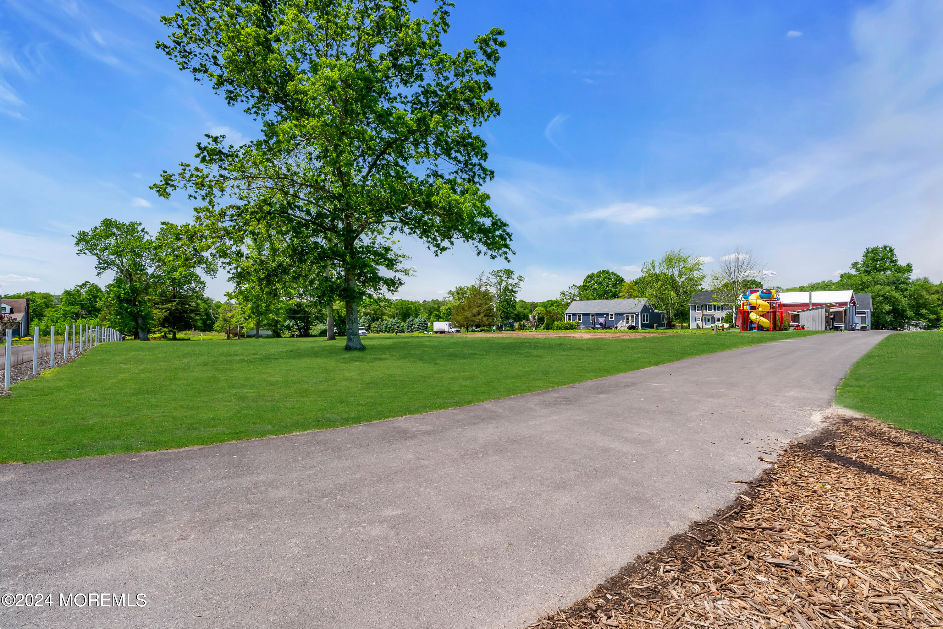 553 Colts Neck Road Farmingdale, NJ 07727 - Photo 4 of 52 a view of a park with plants and large trees