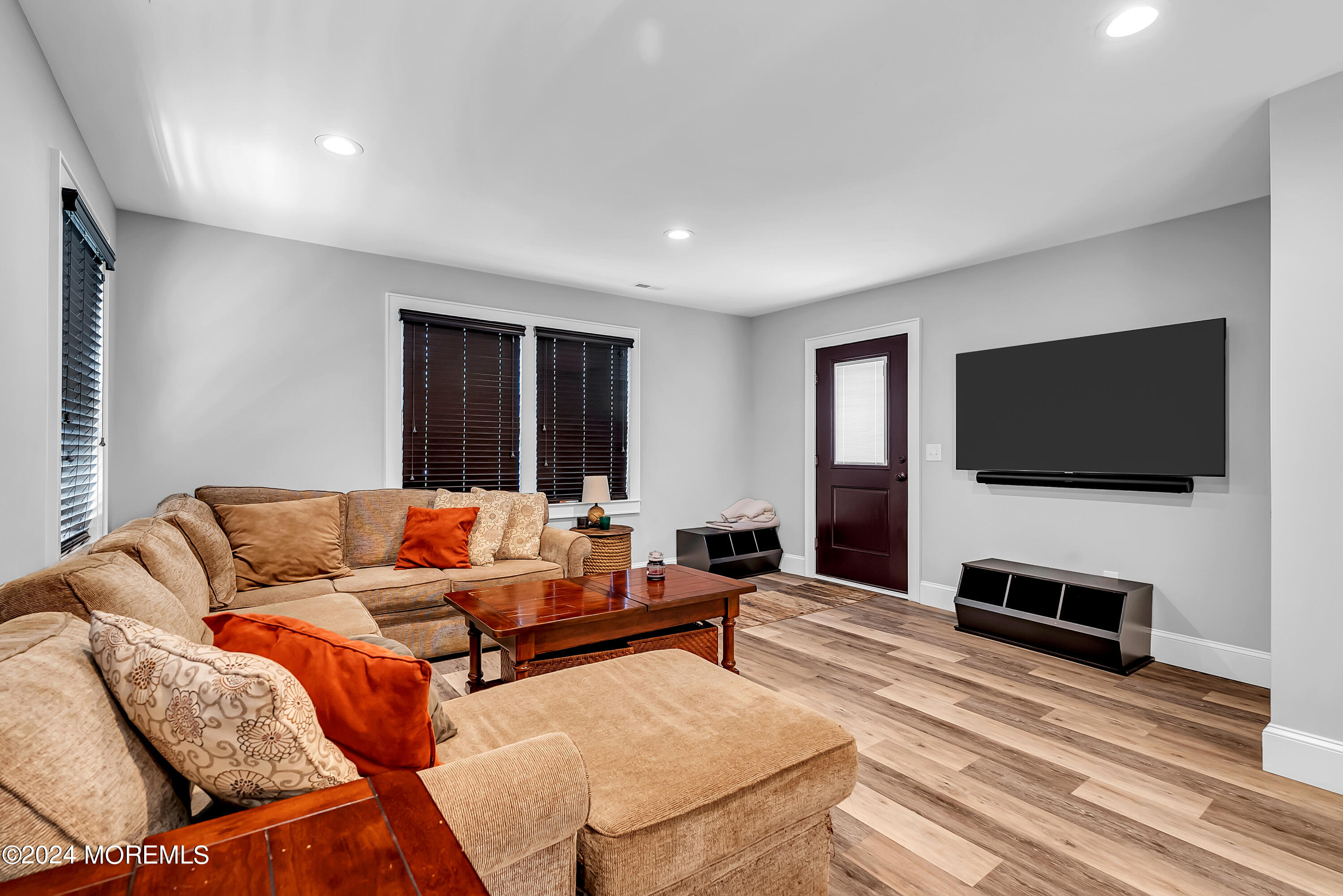 553 Colts Neck Road Farmingdale, NJ 07727 - Photo 42 of 52 a living room with furniture and a flat screen tv