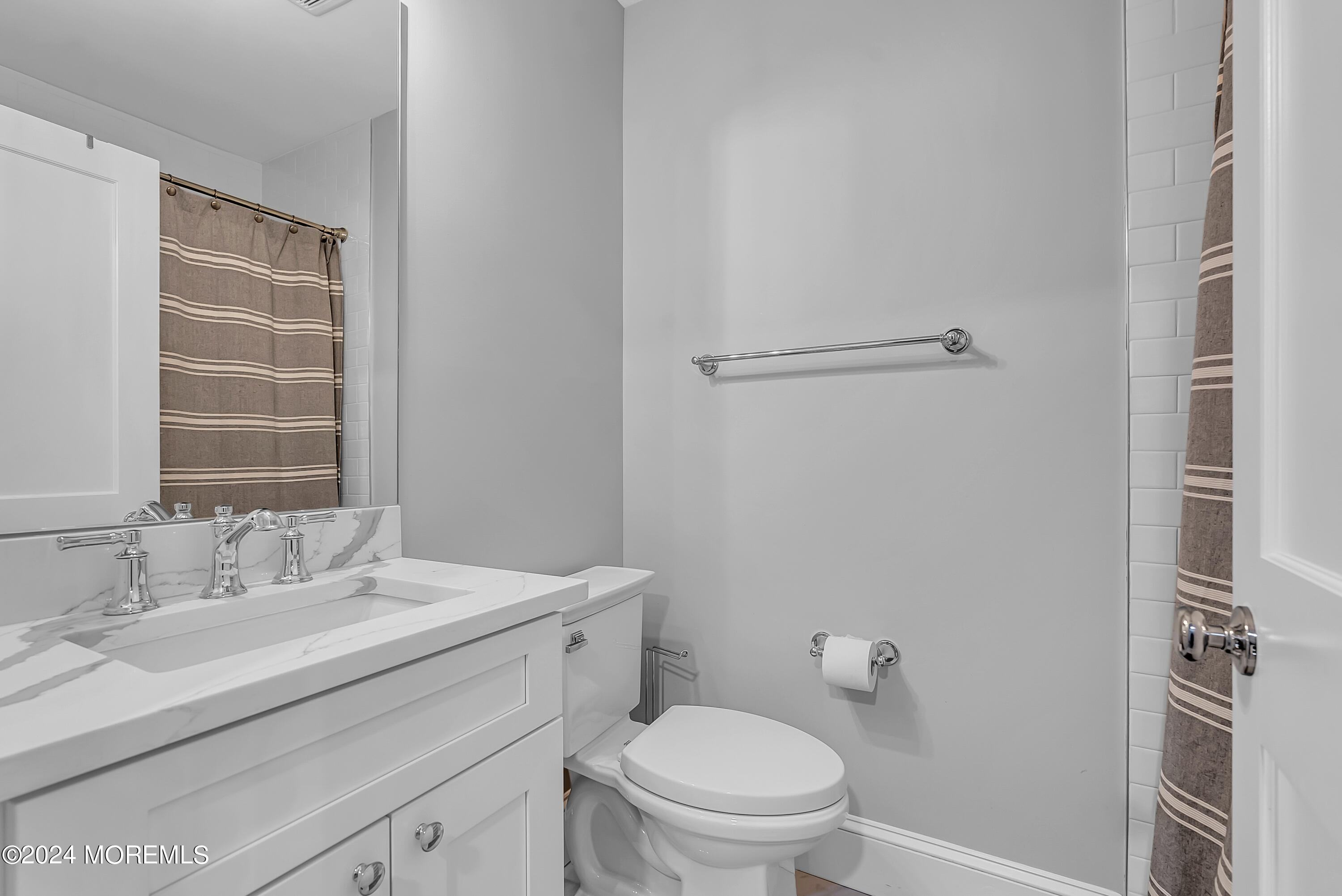 553 Colts Neck Road Farmingdale, NJ 07727 - Photo 45 of 52 a bathroom with a sink toilet vanity and shower