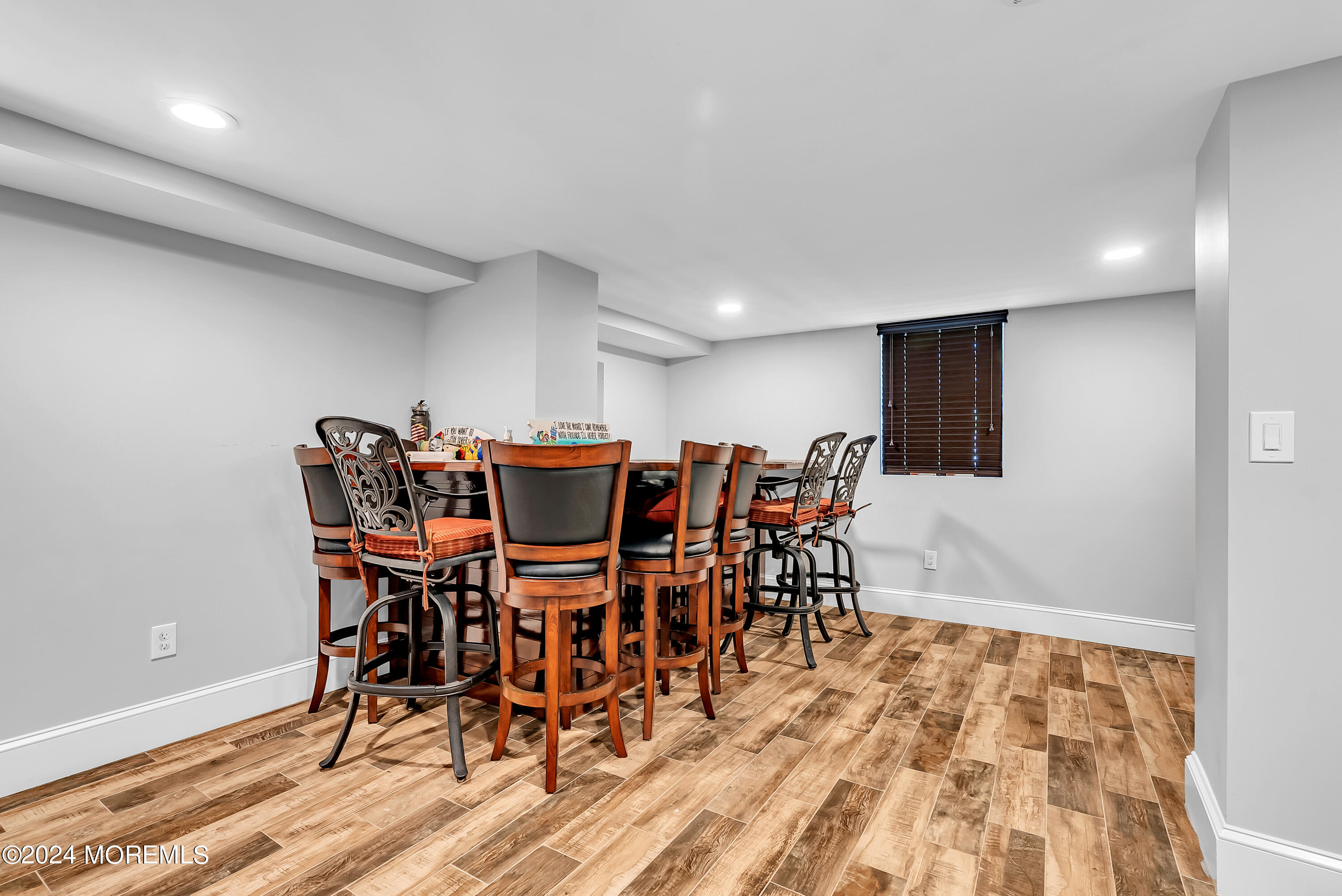 553 Colts Neck Road Farmingdale, NJ 07727 - Photo 50 of 52 a view of a dining area with furniture and wooden floor