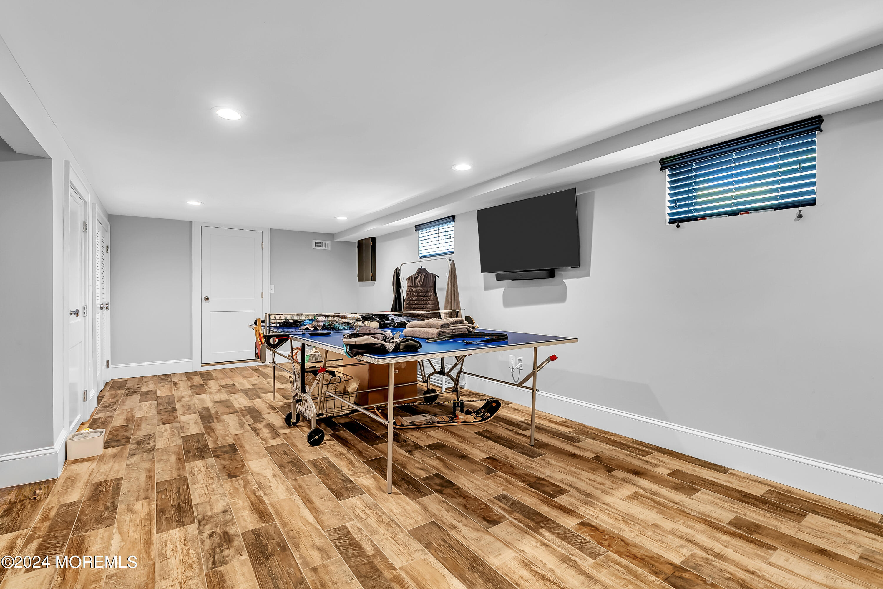 553 Colts Neck Road Farmingdale, NJ 07727 - Photo 51 of 52 a living room with furniture a rug and a flat screen tv