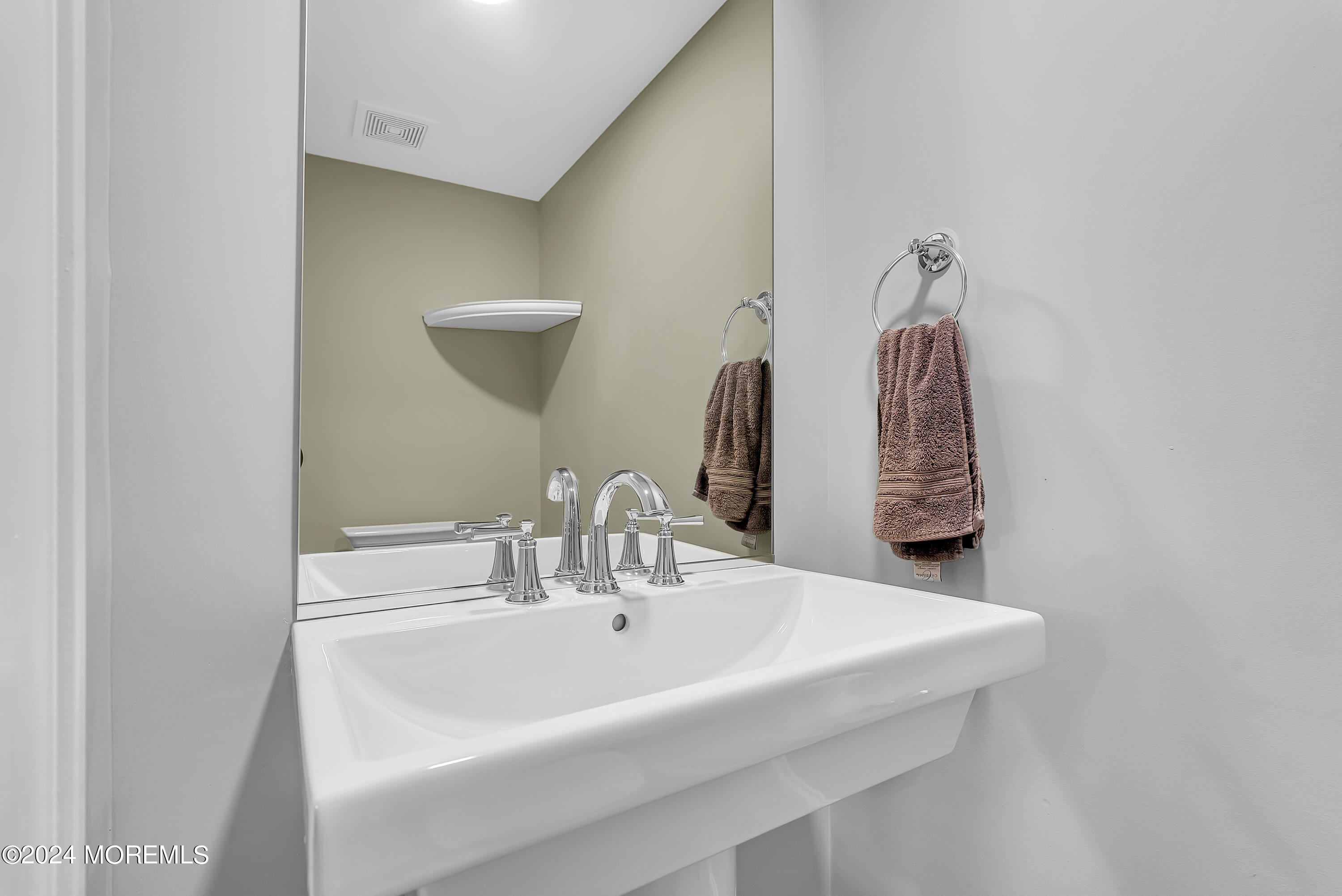 553 Colts Neck Road Farmingdale, NJ 07727 - Photo 52 of 52 a bathroom with a sink and a mirror