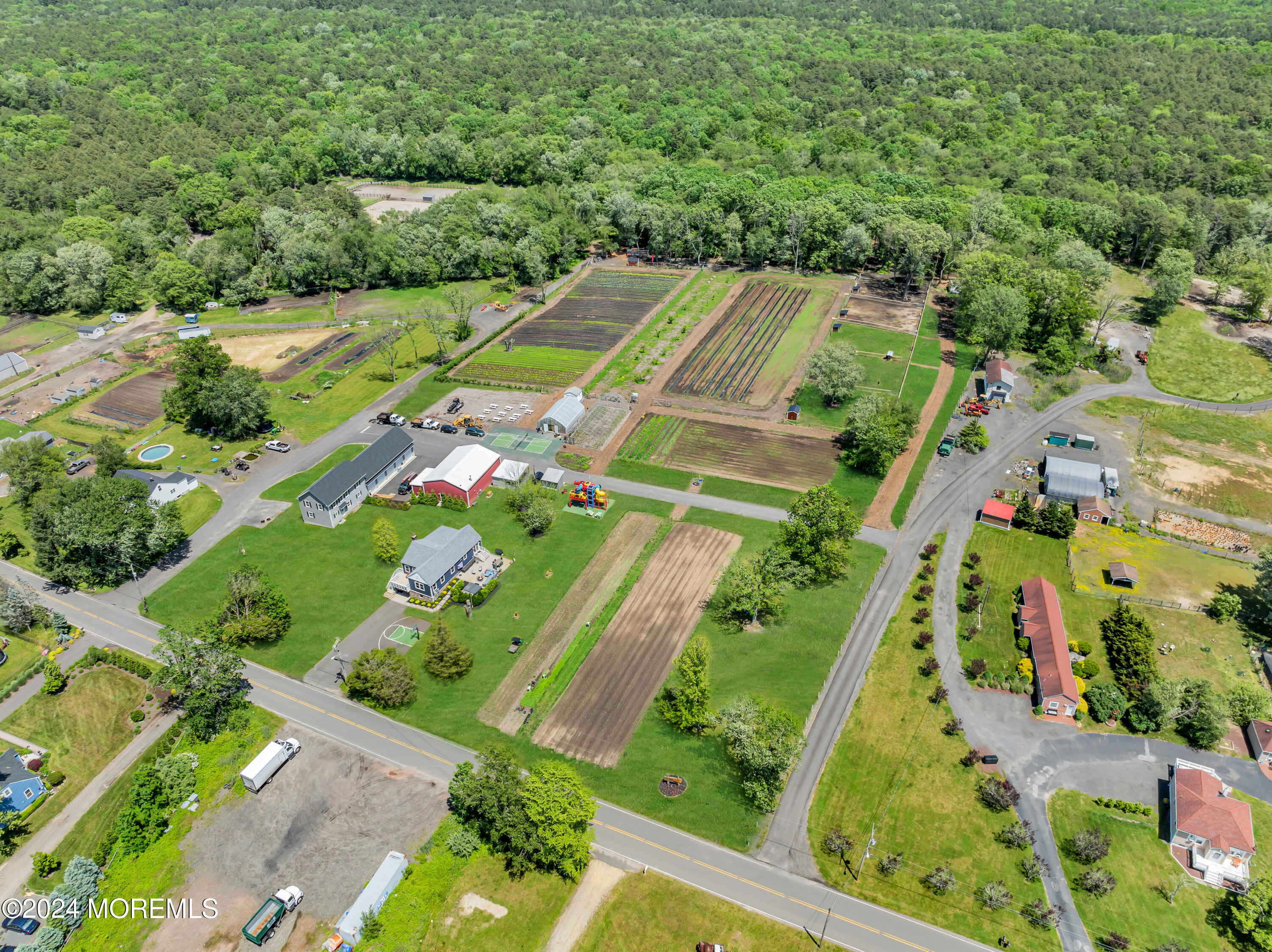 553 Colts Neck Road Farmingdale, NJ 07727 - Photo 9 of 52 an aerial view of multiple houses with yard