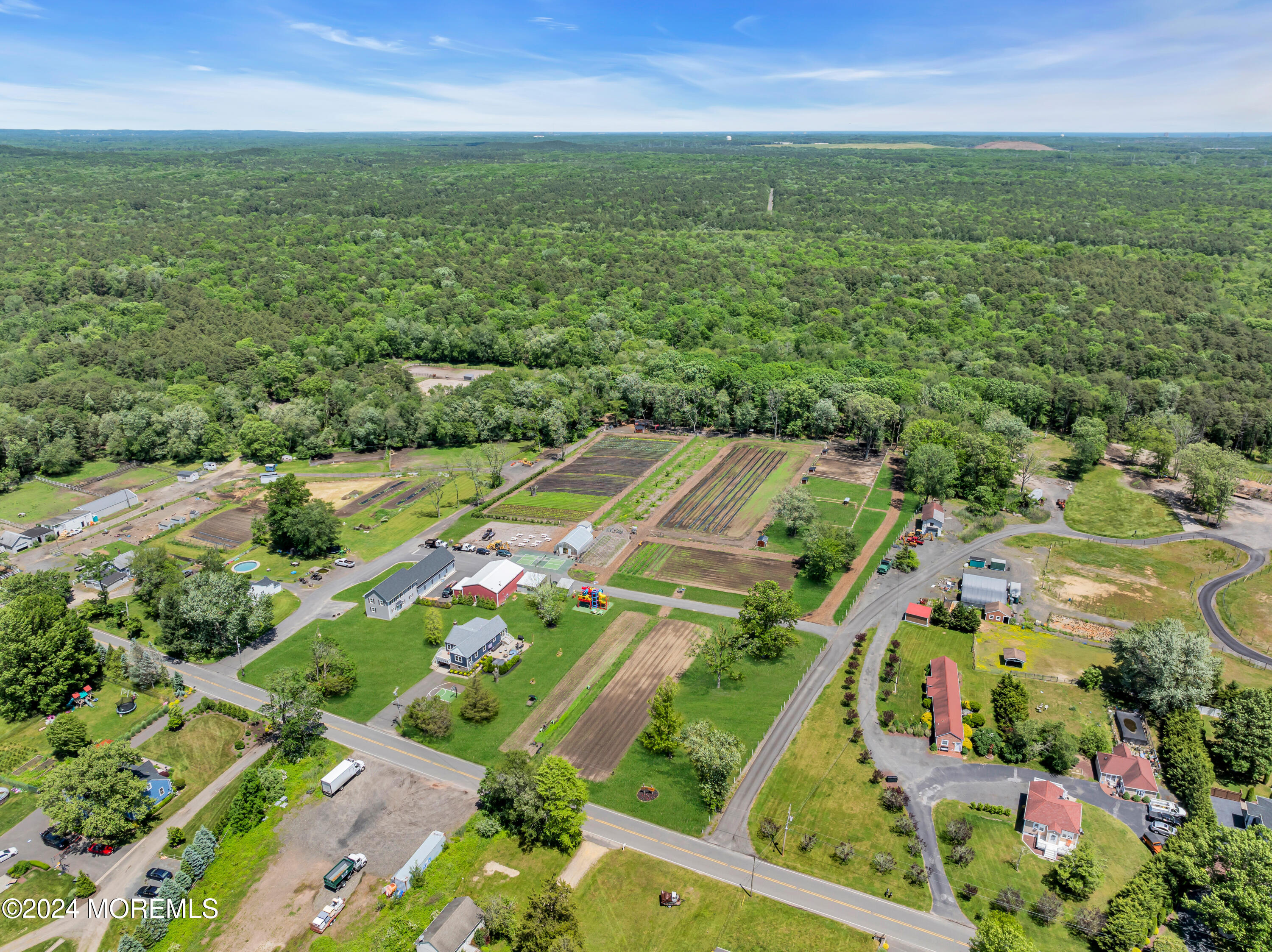 553 Colts Neck Road Farmingdale, NJ 07727 - Photo 10 of 52 an aerial view of residential houses with outdoor space and trees