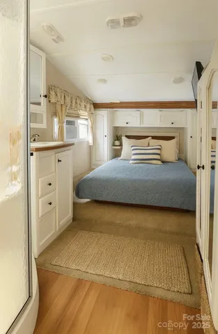 a bathroom with a glass shower door and a glass door shower