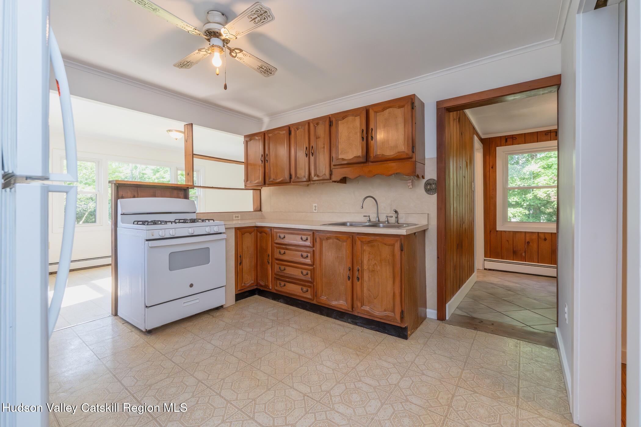 4533 Atwood Road Stone Ridge, NY 12484 - Photo 16 of 63 a kitchen with a stove oven and a sink