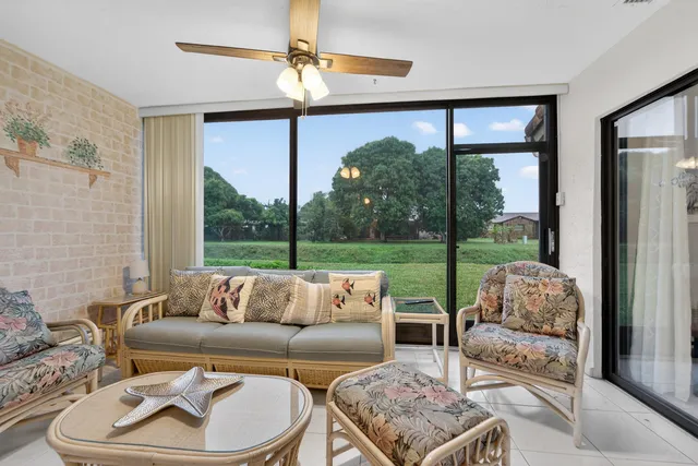 a bedroom with a bed and a flat tv screen on dresser
