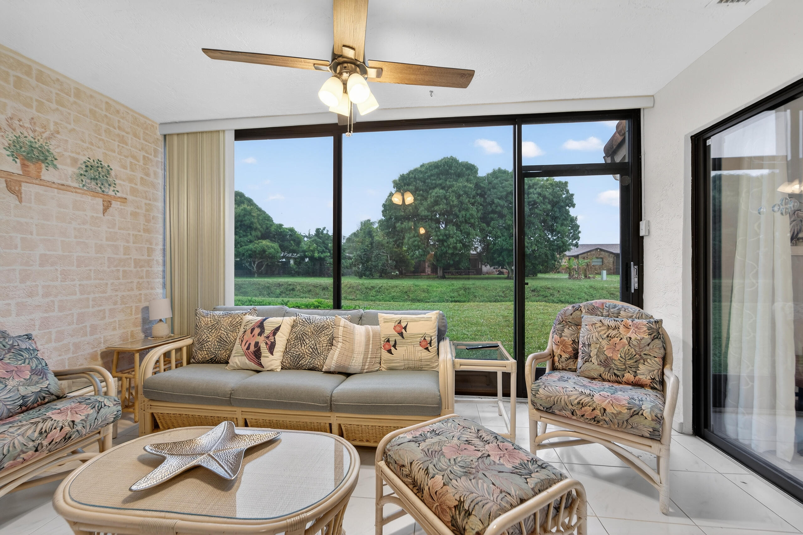 6220 Kings Gate Circle Delray Beach, FL 33484 - Photo 15 of 59 a living room with furniture and a large window