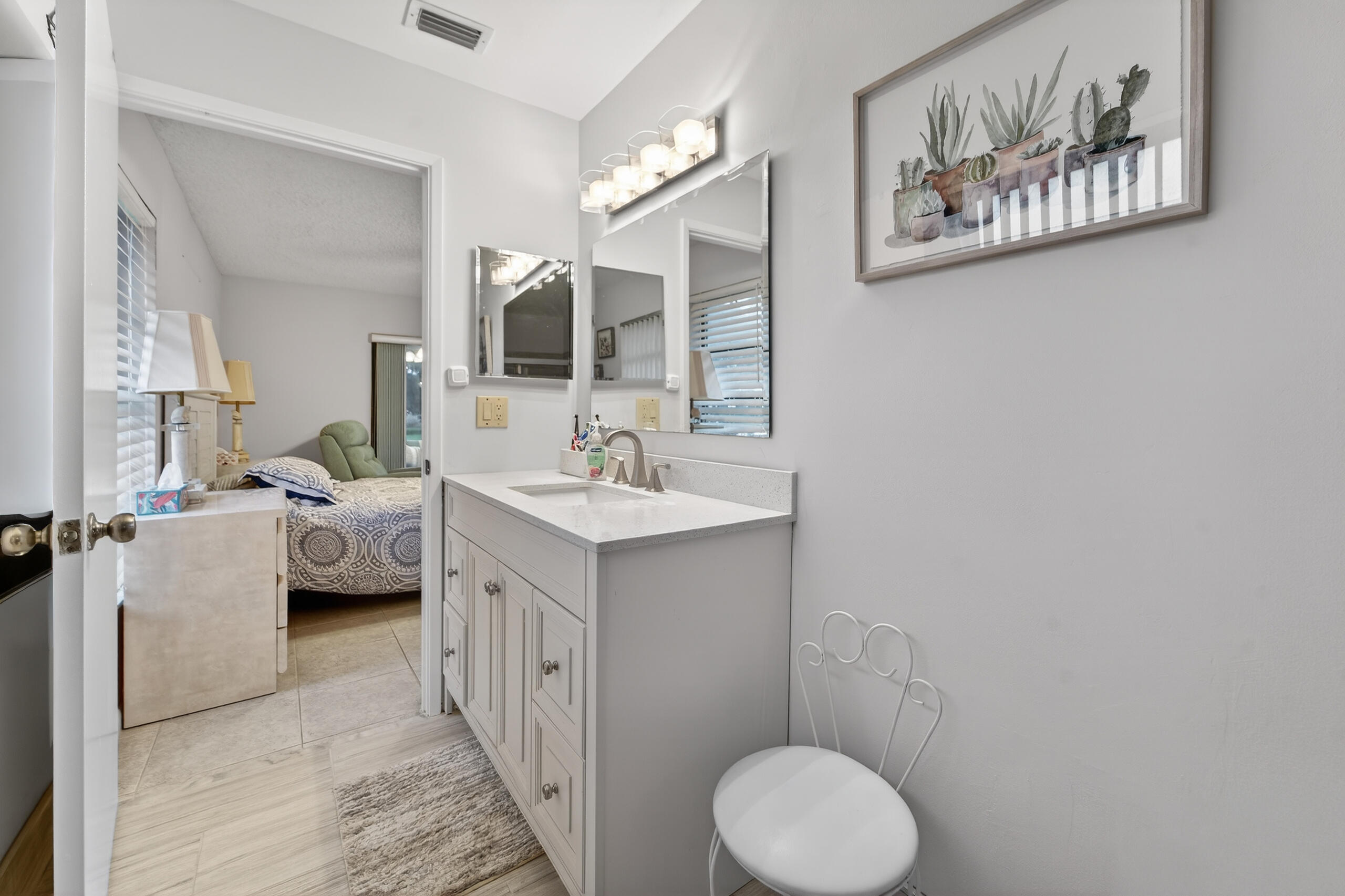 6220 Kings Gate Circle Delray Beach, FL 33484 - Photo 19 of 59 a en suite bathroom with a toilet sink and mirror