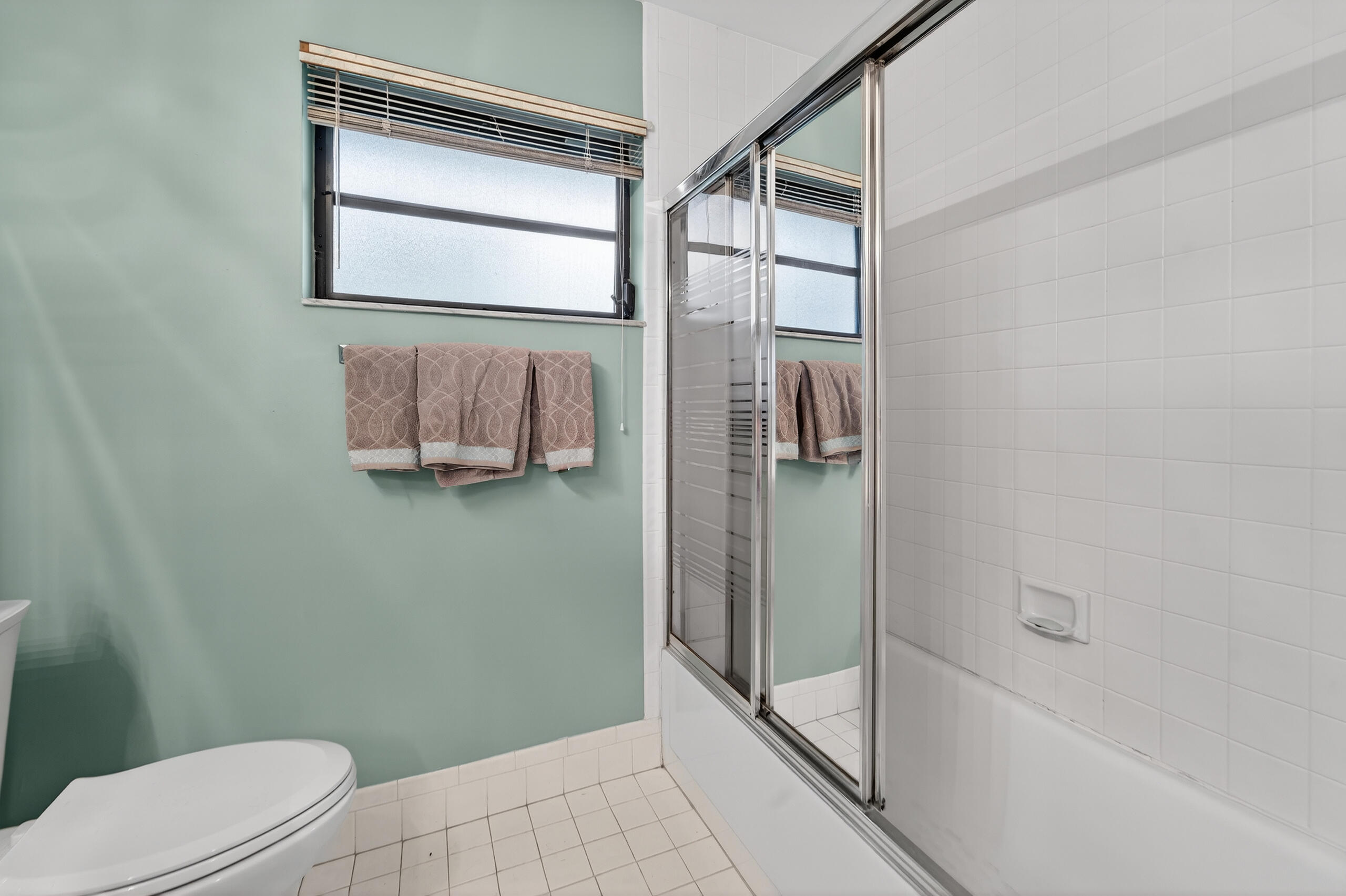 6220 Kings Gate Circle Delray Beach, FL 33484 - Photo 24 of 59 a bathroom with a shower and toilet