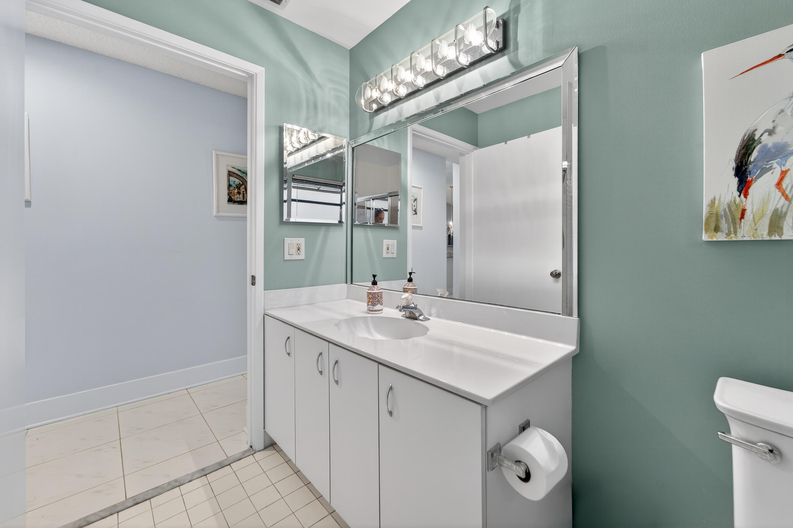 6220 Kings Gate Circle Delray Beach, FL 33484 - Photo 25 of 59 a bathroom with a sink a toilet and a mirror
