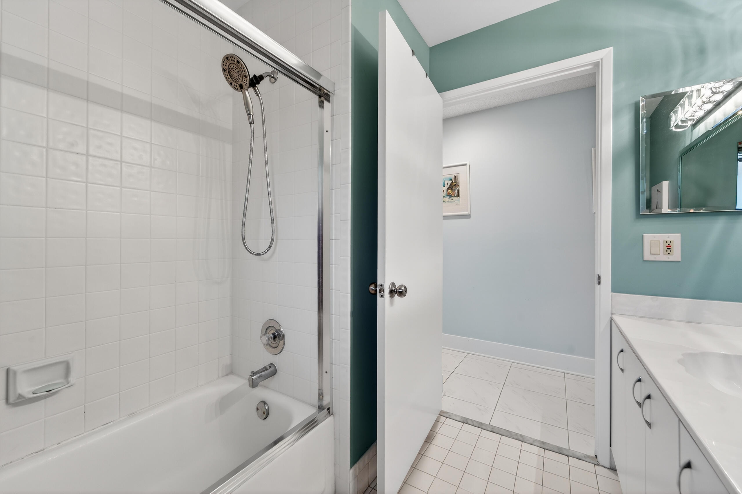 6220 Kings Gate Circle Delray Beach, FL 33484 - Photo 26 of 59 a bathroom with a granite countertop shower a mirror and a sink