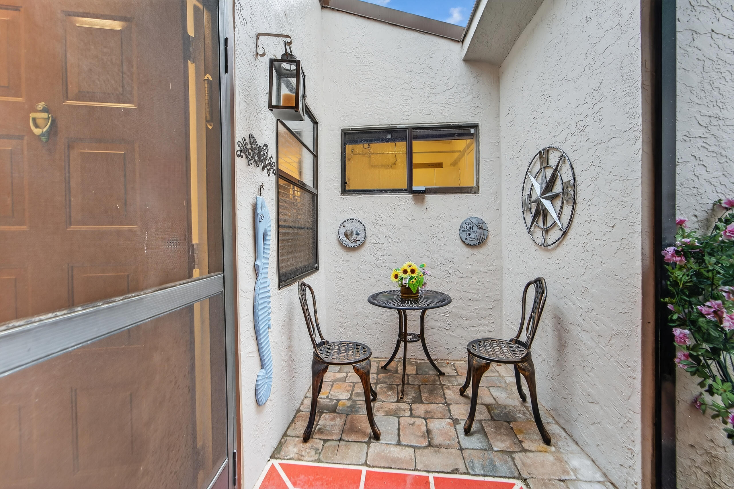 6220 Kings Gate Circle Delray Beach, FL 33484 - Photo 28 of 59 a view of hall way with furniture and rug