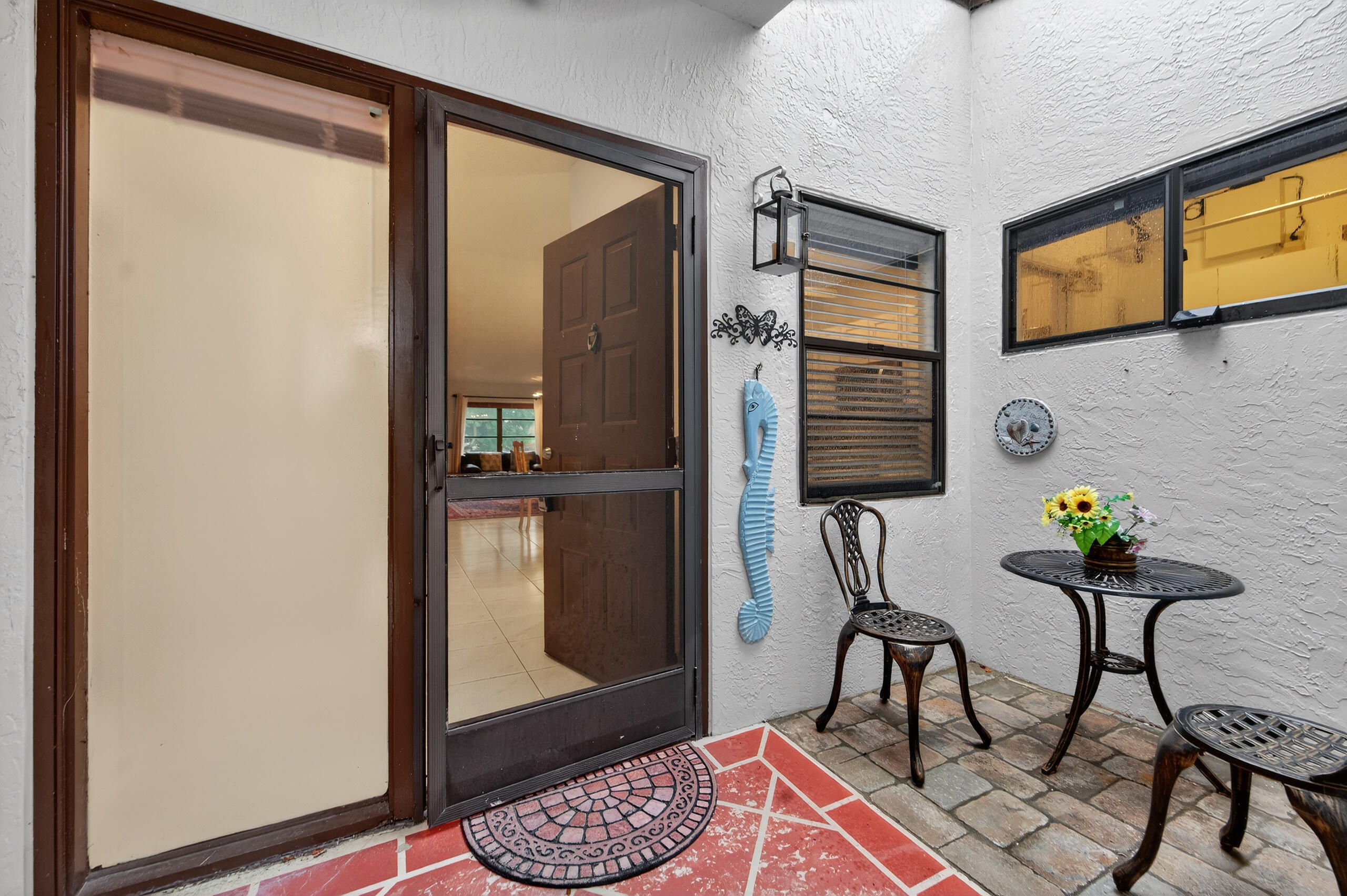 6220 Kings Gate Circle Delray Beach, FL 33484 - Photo 29 of 59 a dining room with furniture and window