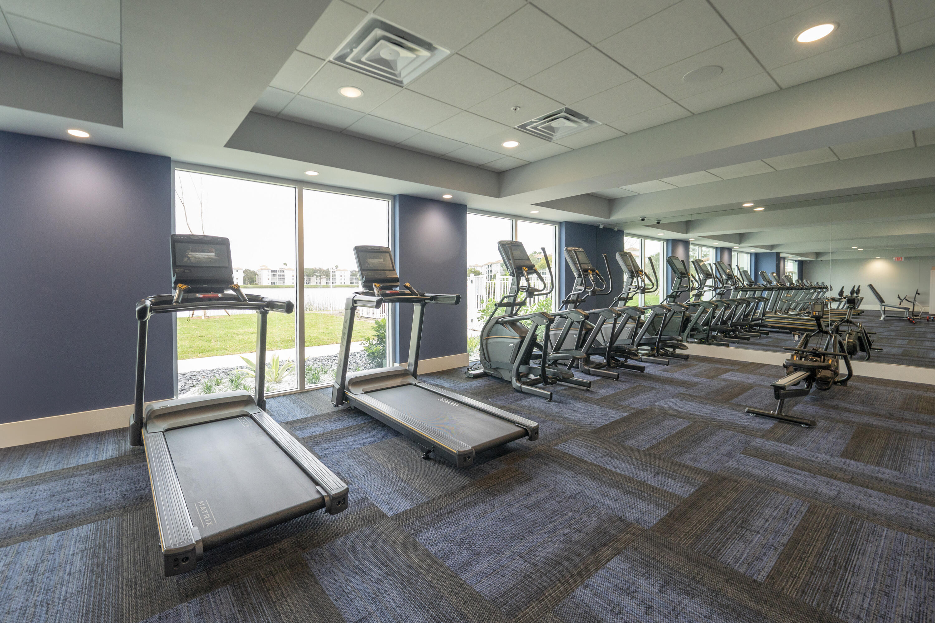 6220 Kings Gate Circle Delray Beach, FL 33484 - Photo 44 of 59 a view of a room with gym equipment