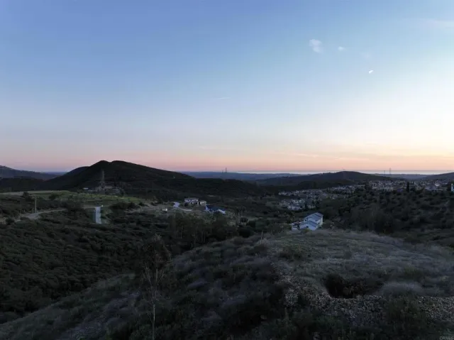 a view of a town with mountains in the background