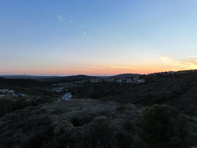 a view of a town with mountains in the background