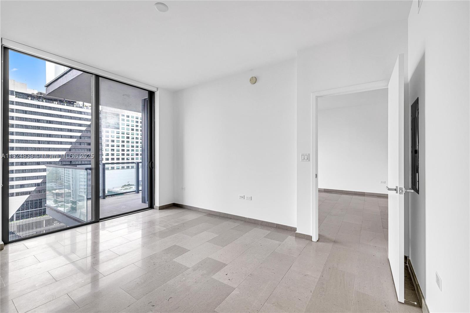 88 Southwest 7th Street, Unit 1006 Miami, FL 33130 - Photo 18 of 24 an empty room with windows