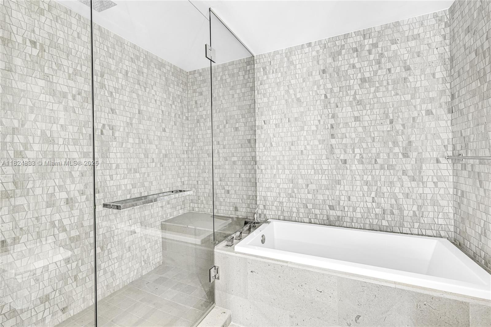 88 Southwest 7th Street, Unit 1006 Miami, FL 33130 - Photo 22 of 24 a bathroom with a bathtub and a shower