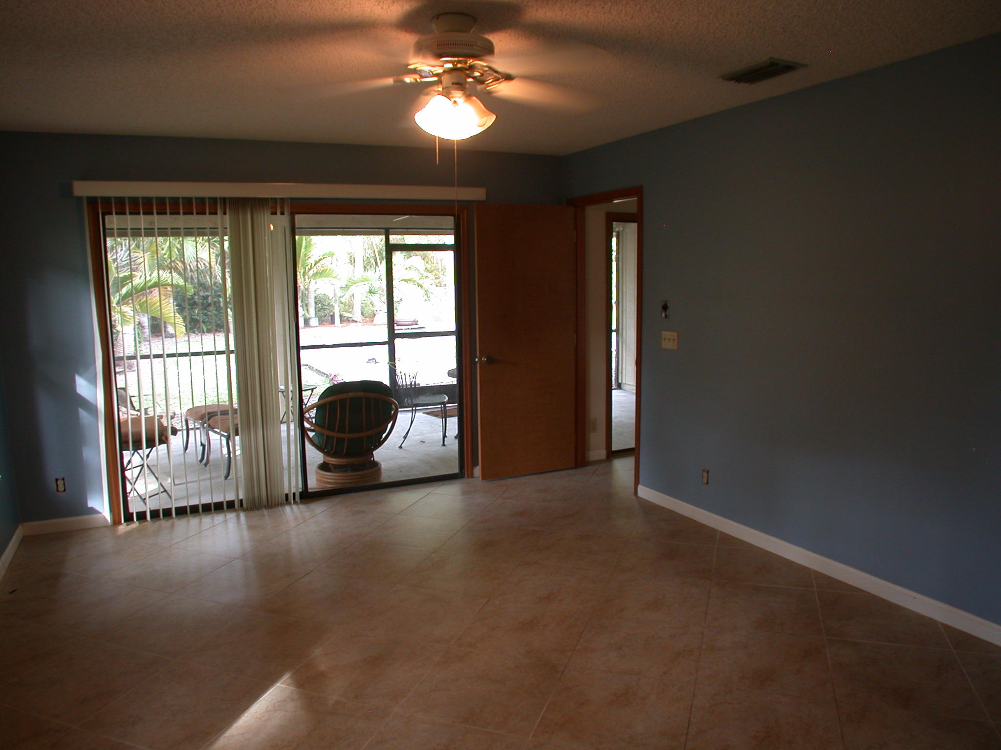 10111 Sandy Run Road Jupiter, FL 33478 - Photo 5 of 14 a view of a livingroom with furniture hardwood floor and a ceiling fan