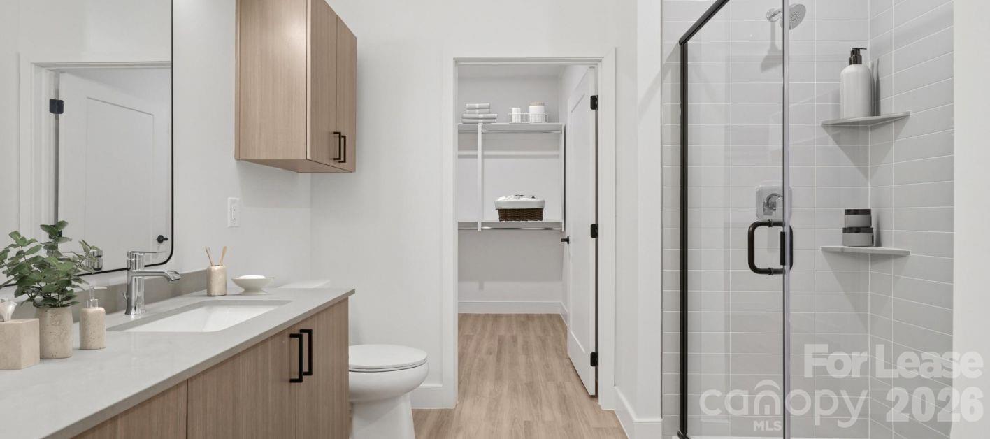 2222 North Tryon Street, Unit S3 Charlotte, NC 28206 - Photo 8 of 12 a bathroom with a sink a toilet and shower