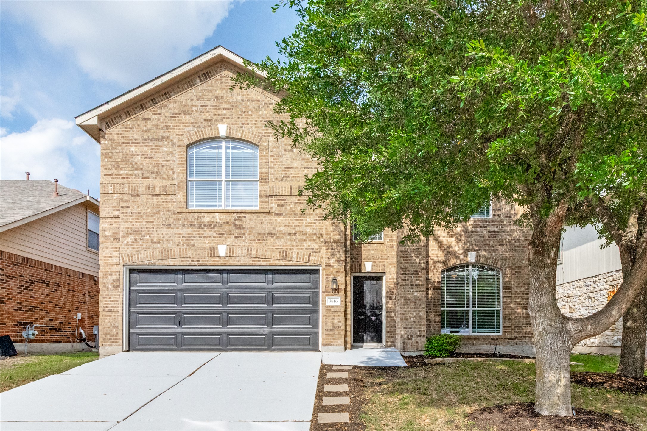 3816 Bandice Lane Pflugerville, TX 78660 - Photo 1 of 33 View of front of home featuring brick siding, an attached garage, and concrete driveway