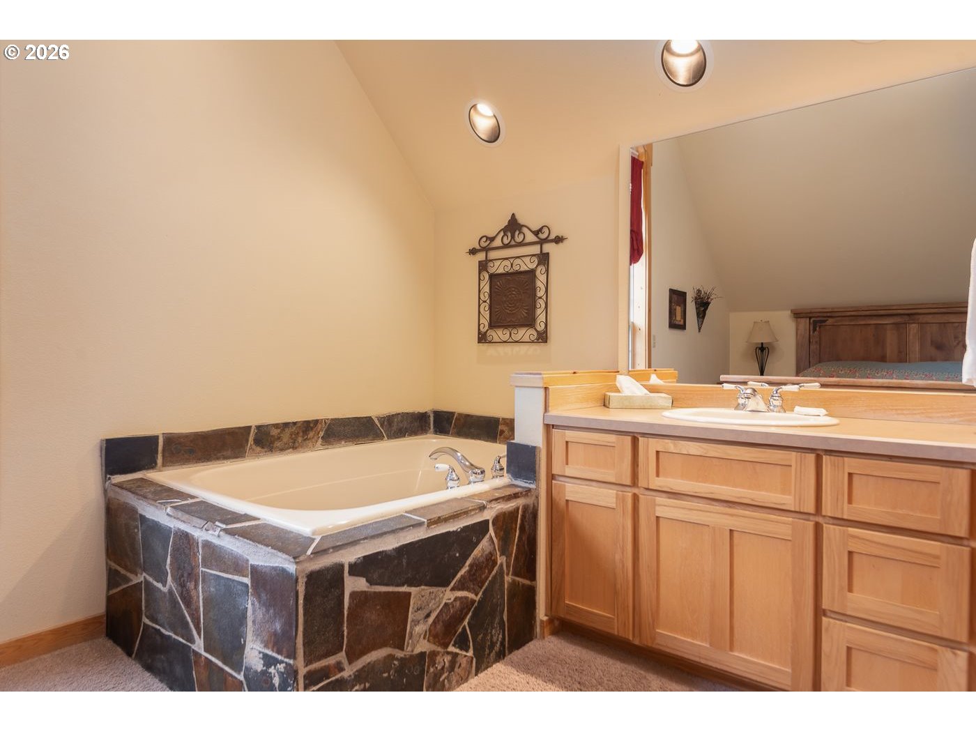 8968 Cliff Swallow Drive Redmond, OR 97756 - Photo 13 of 25 a bathroom with a sink and a mirror