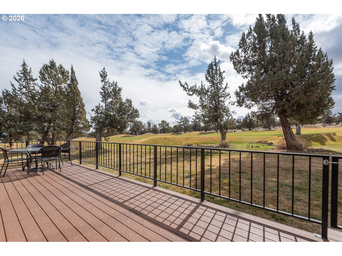 8968 Cliff Swallow Drive Redmond, OR 97756 - Photo 23 of 25 a view of balcony with wooden floor and fence